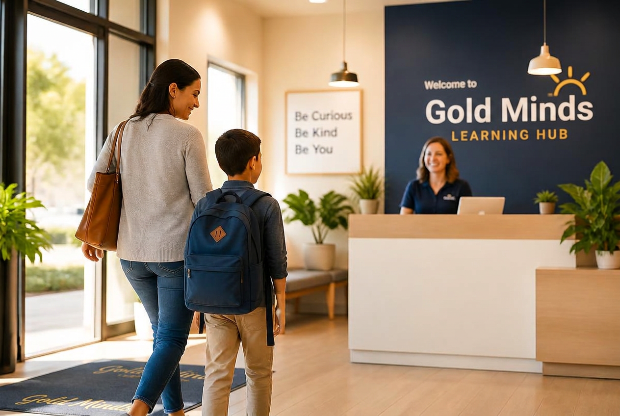 A parent and child are warmly greeted at the Gold Minds Learning Hub welcome desk